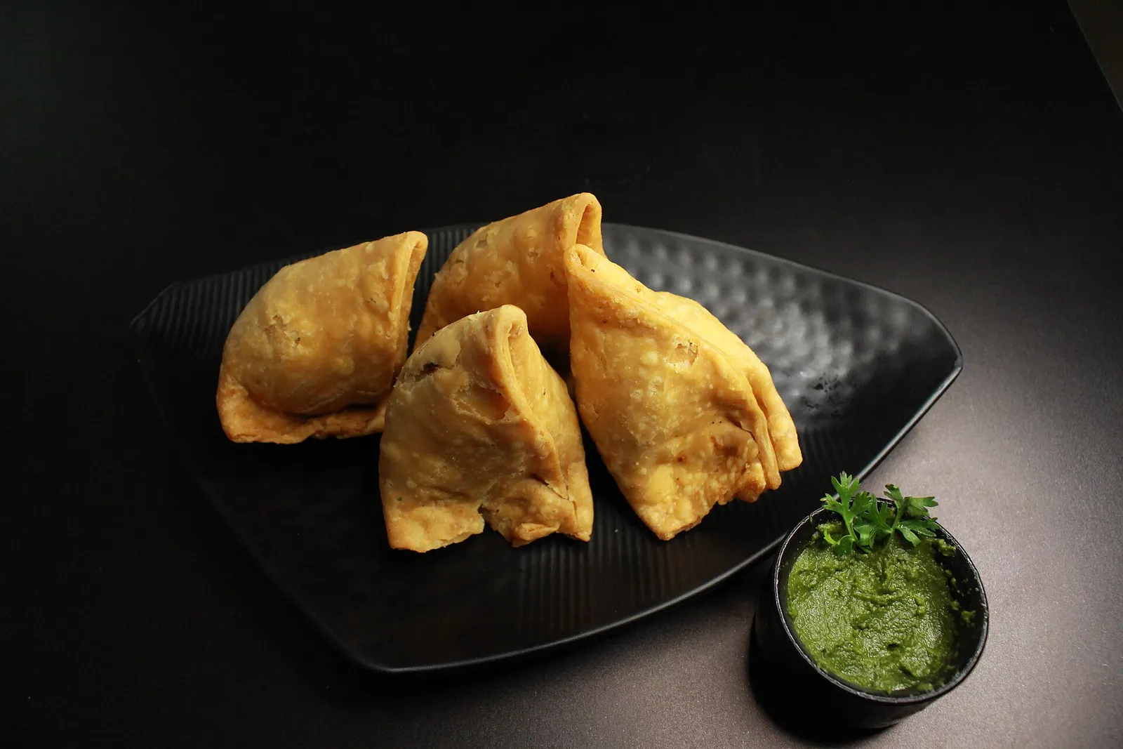 Samosas with green chutney